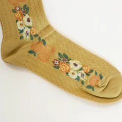 andéotte knæstrømper - Gule med orange blomster